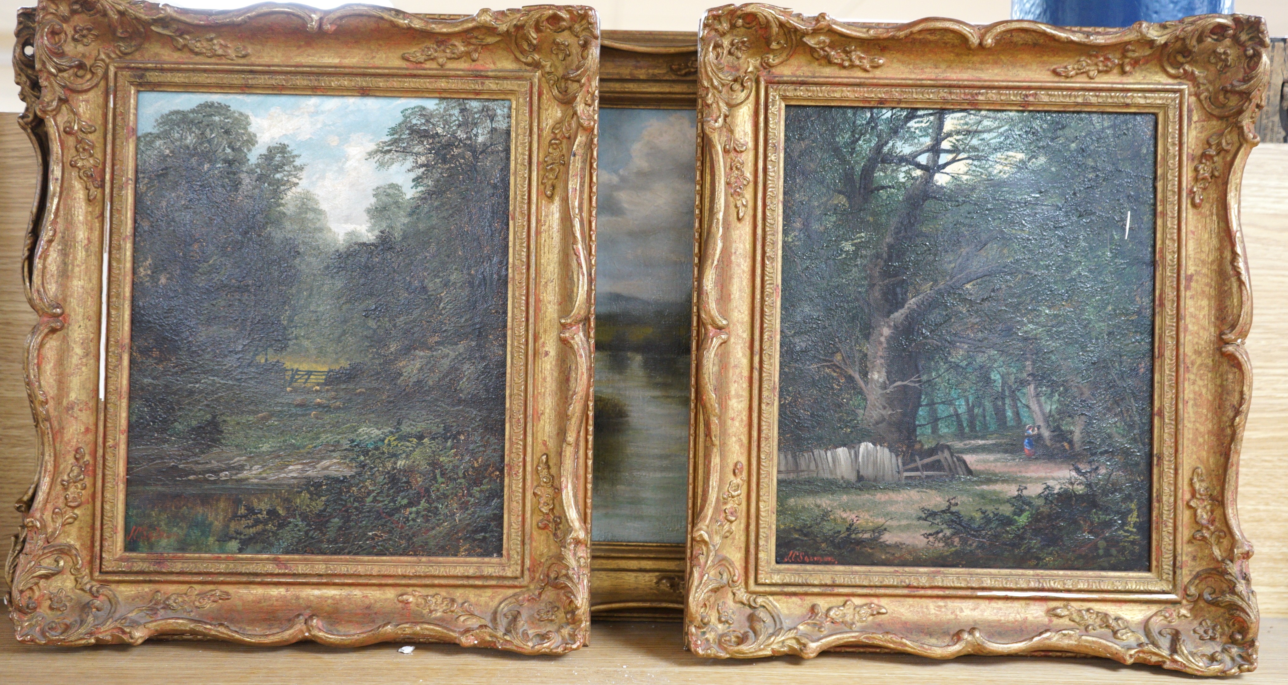 John Cuthbert Salmon (1844-1917), pair of oils on canvas, Figures in woodland and Sheep in pasture, signed, 29 x 24cm and a riverscape by another hand, 30 x 44cm